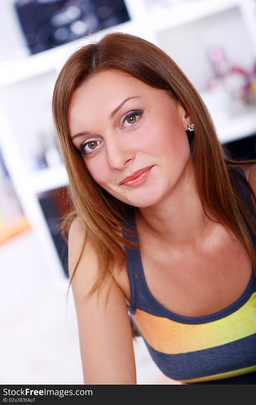 Closeup portrait of cute young girl smiling against white background