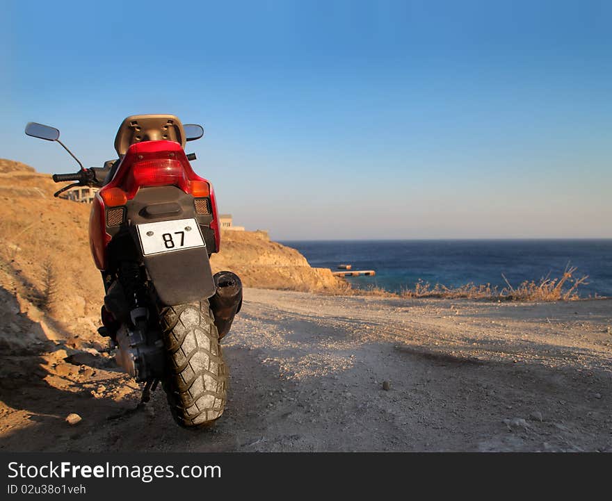 Motorbike standing on a beach. Motorbike standing on a beach