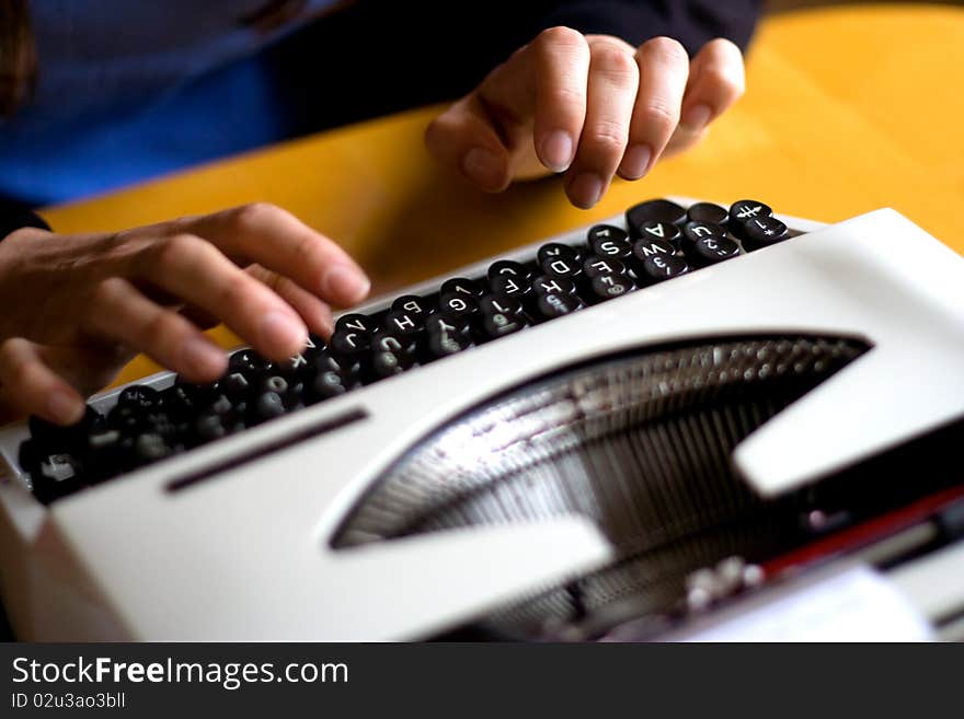 Fingers poised, read to type on a typewriter. Fingers poised, read to type on a typewriter.