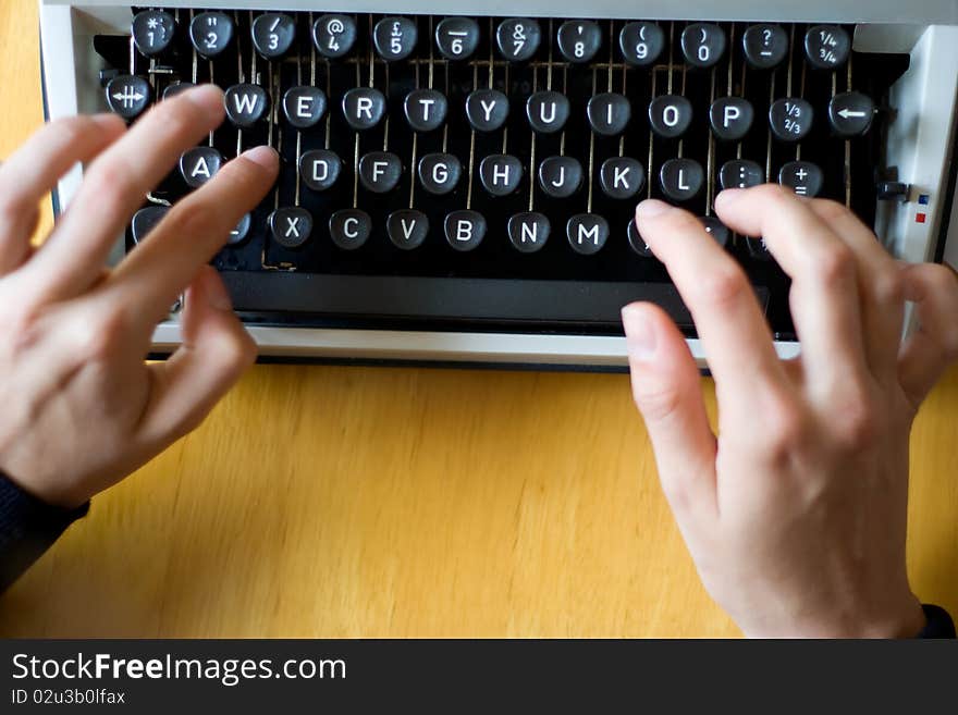 Fingers poised, read to type on a typewriter. Fingers poised, read to type on a typewriter.