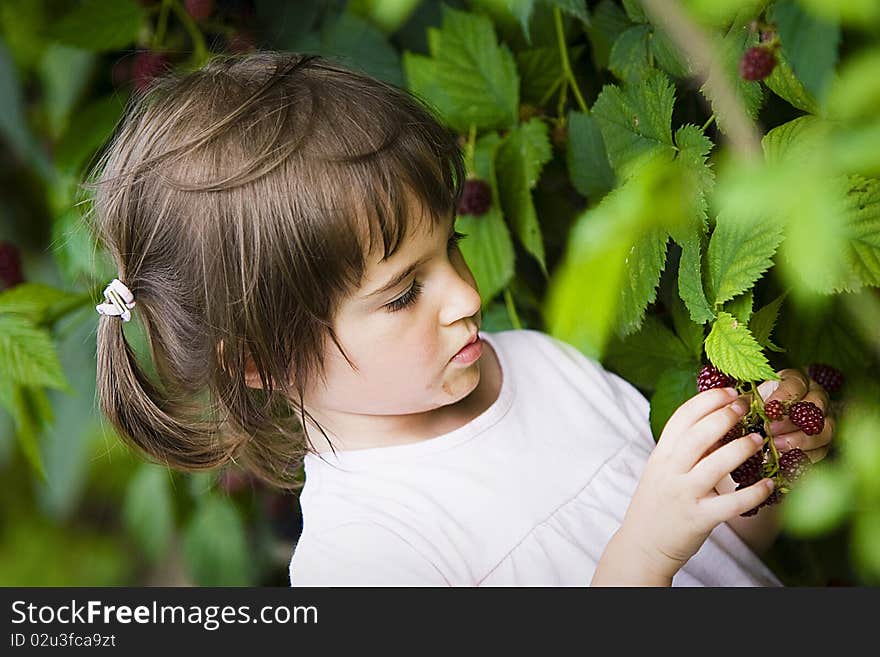 Little girl with berries