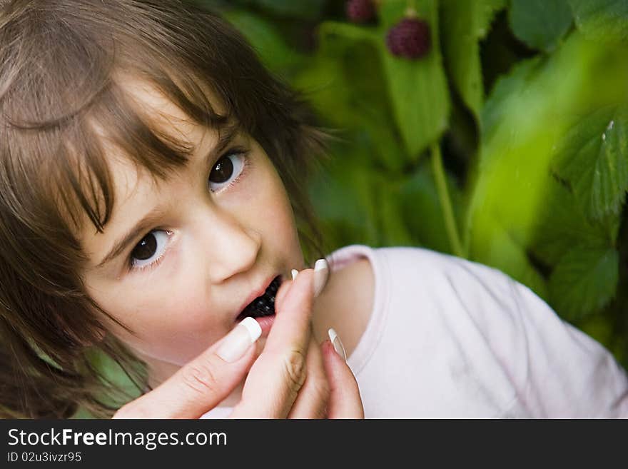 Little girl with berries