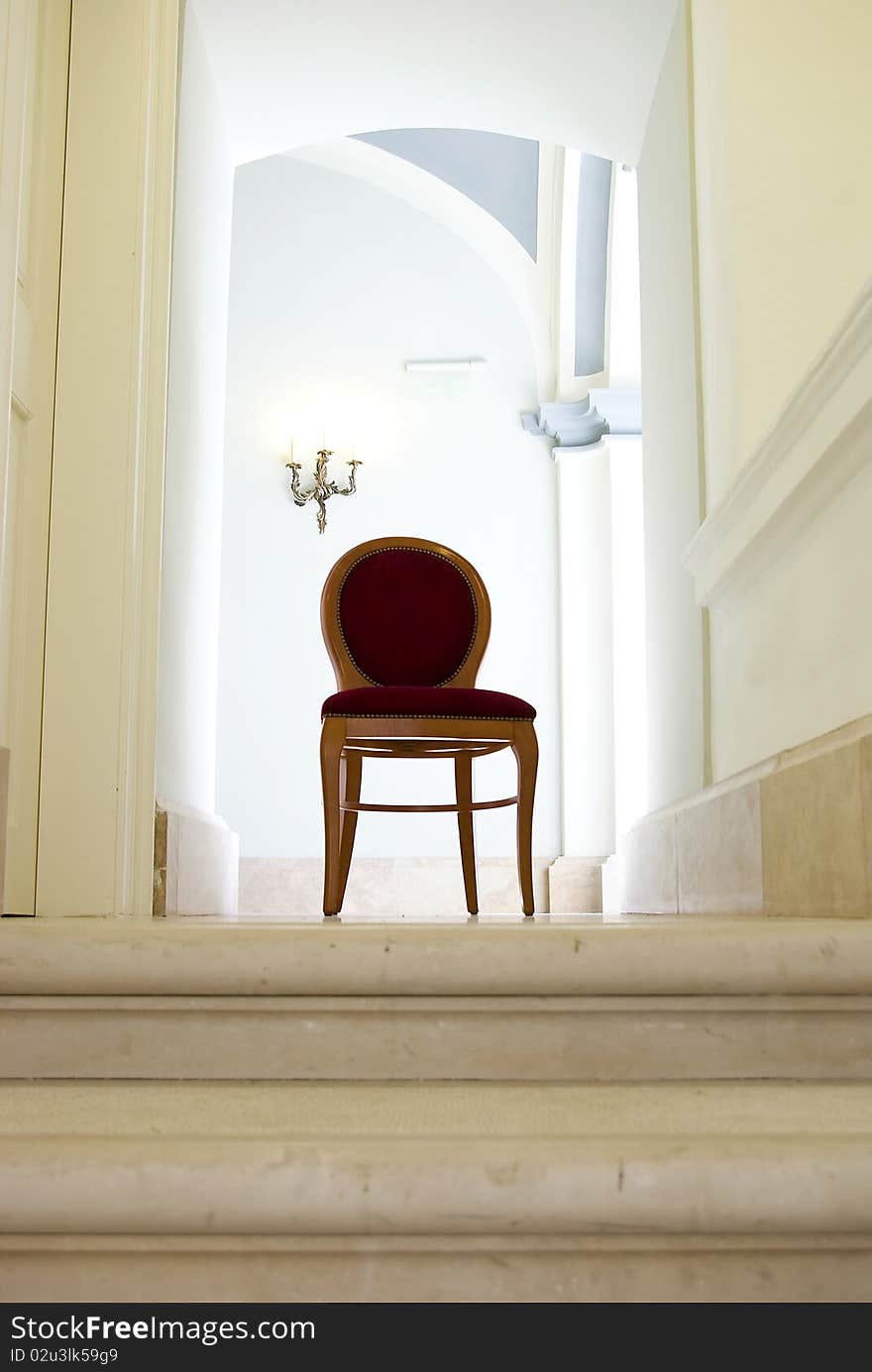 Empty corridor with sunlight and empty red armchair. Empty corridor with sunlight and empty red armchair