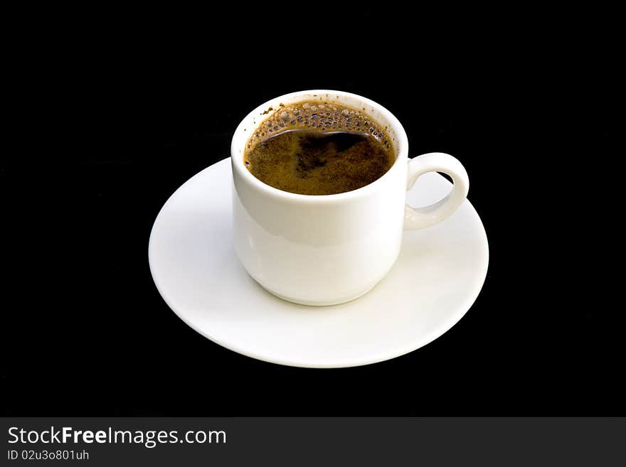 White cup of coffee on black background