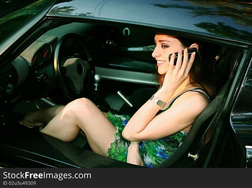 Beautiful girl is talking on telephone