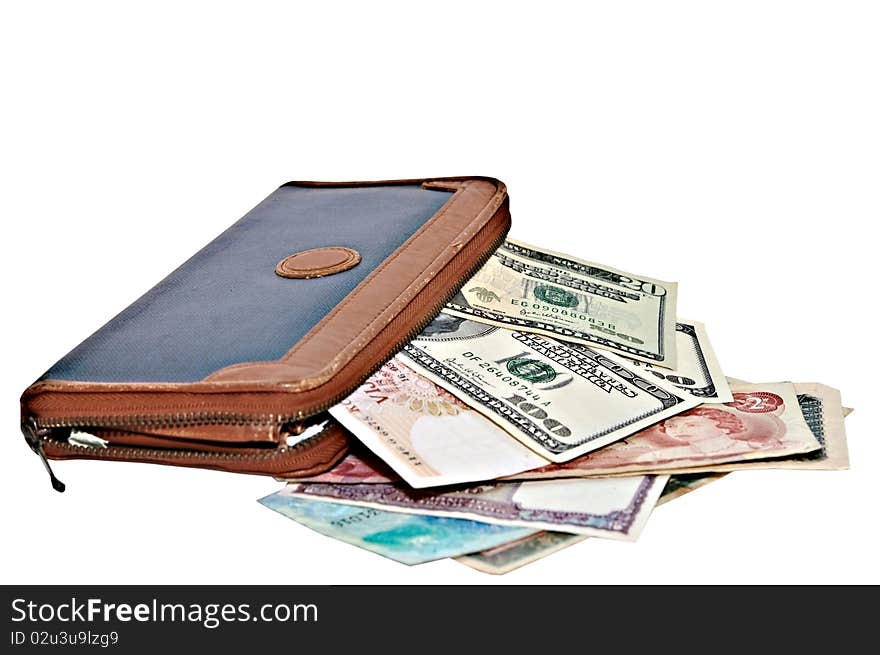 An old large wallet with money from different countries. An old large wallet with money from different countries.