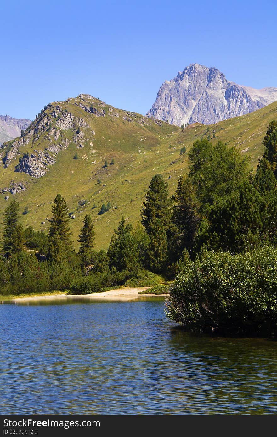 Alpine lake Cavloc Engadine in Switzerland