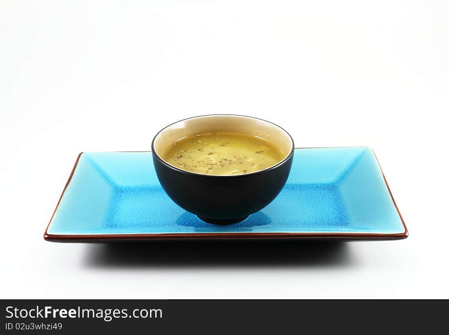 Traditional oriental Tabe Setting with a blue tray and a bowl of soup. Traditional oriental Tabe Setting with a blue tray and a bowl of soup.