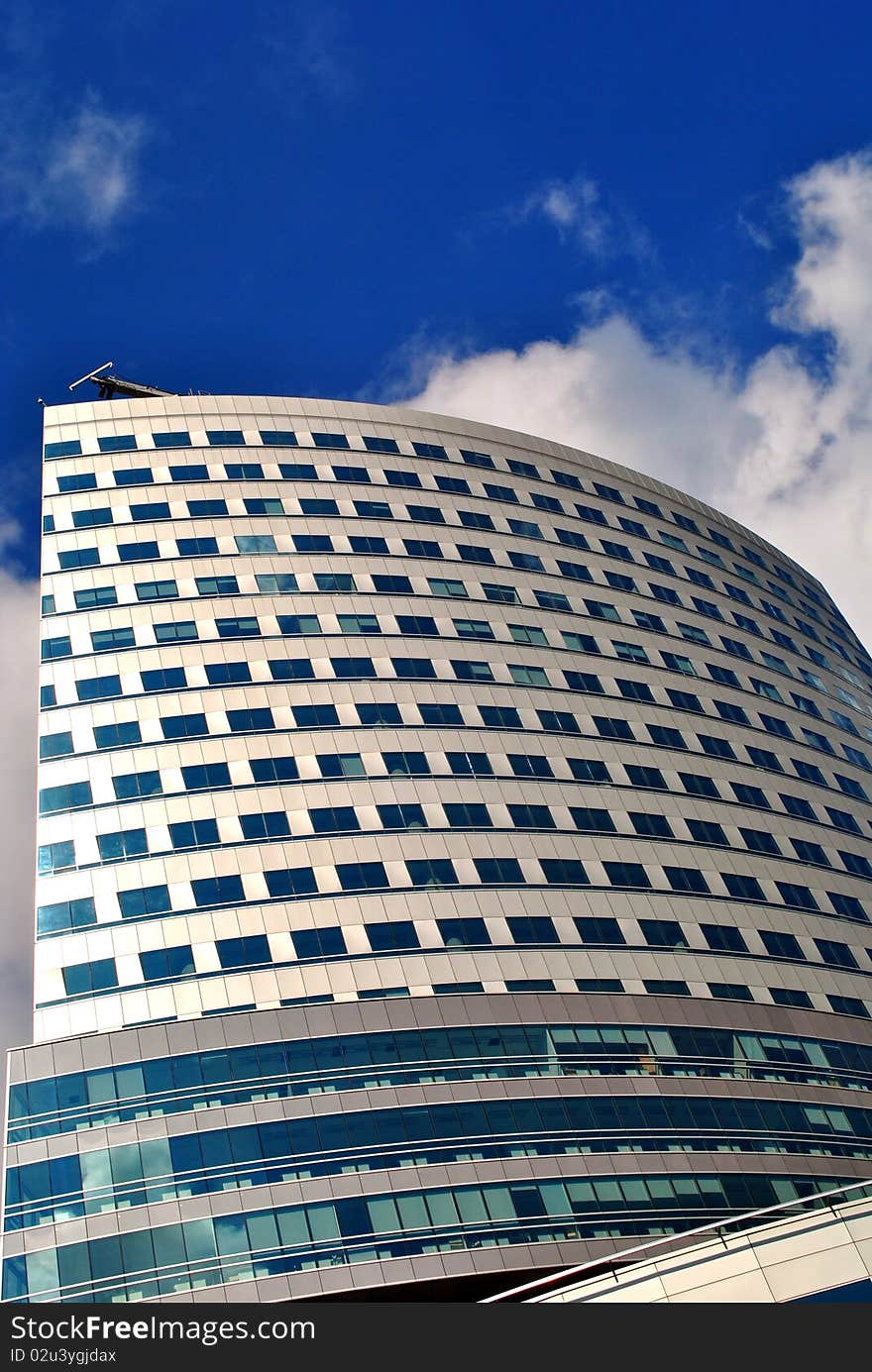 Modern bussines building with clear blue sky in the background. Modern bussines building with clear blue sky in the background