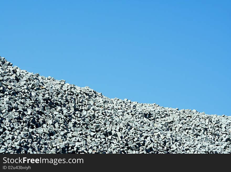 Granite stone pile with blue sky