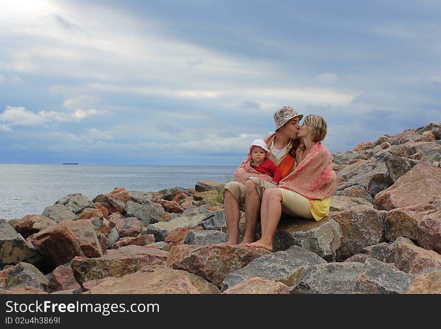 Family sitting on the rocks