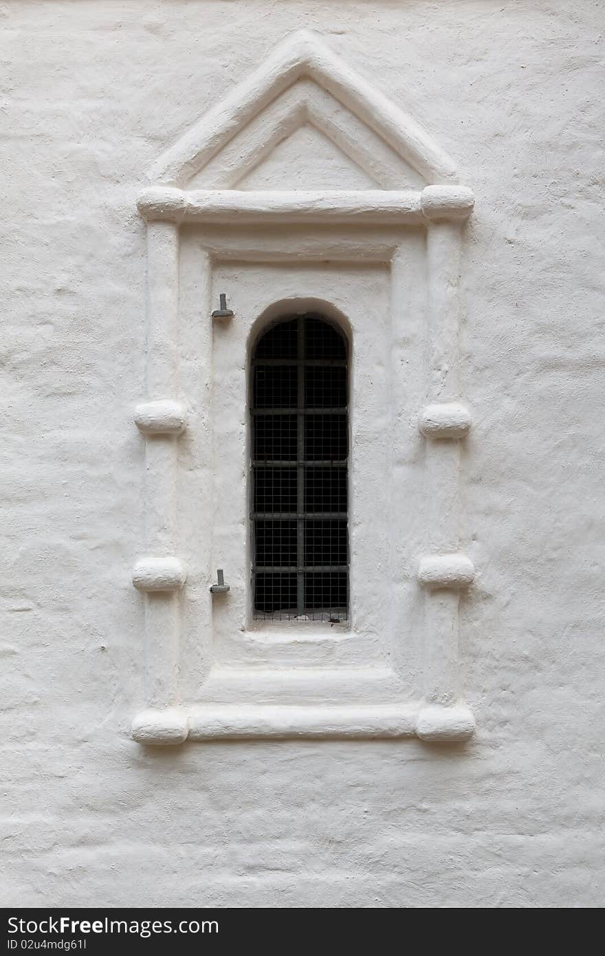 One window of ancient russian church after whitewashing