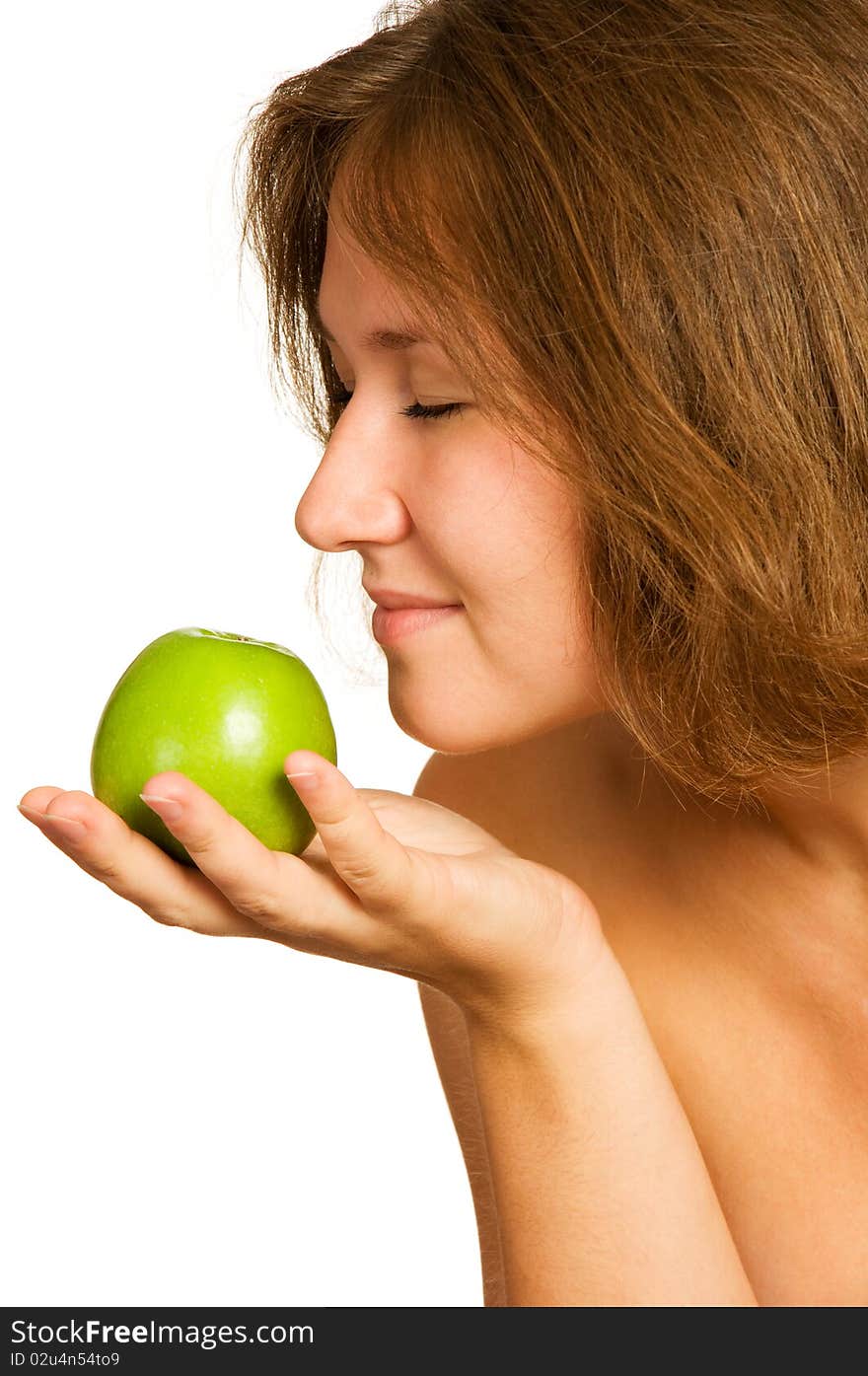 Cute woman smelling fresh apple over white. Cute woman smelling fresh apple over white