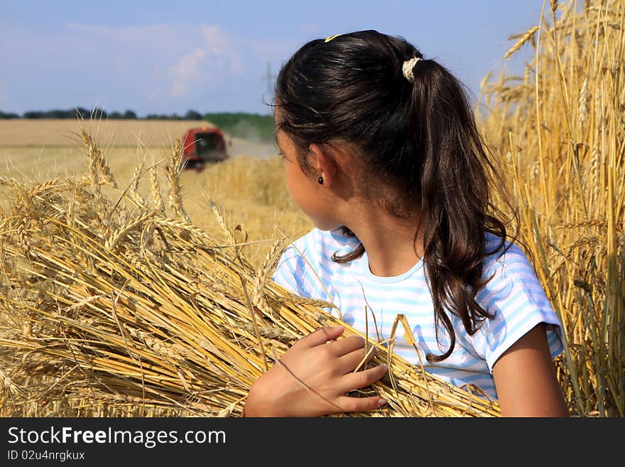 Young Gypsy girl on a grain field