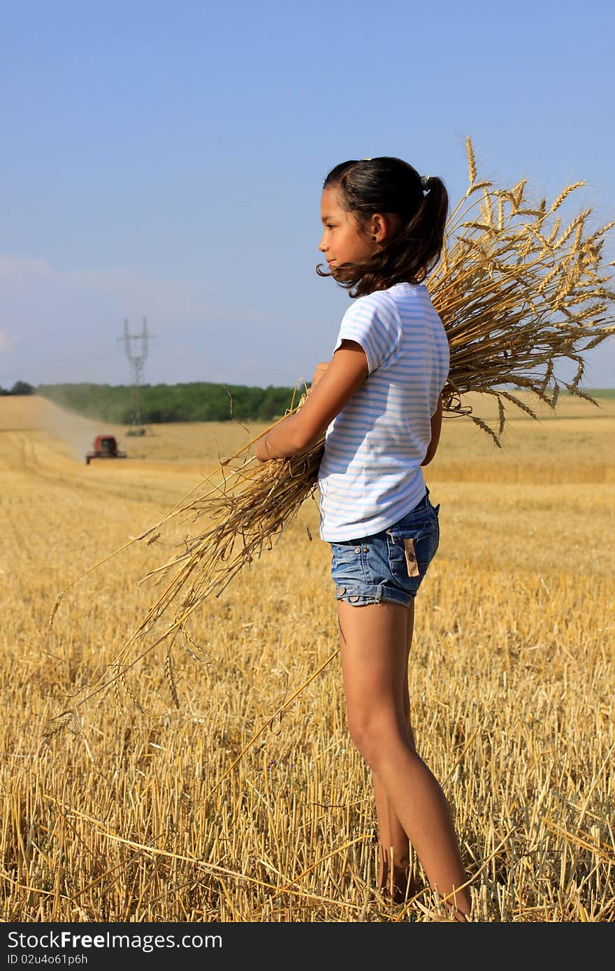 Young Gypsy girl on a grain field