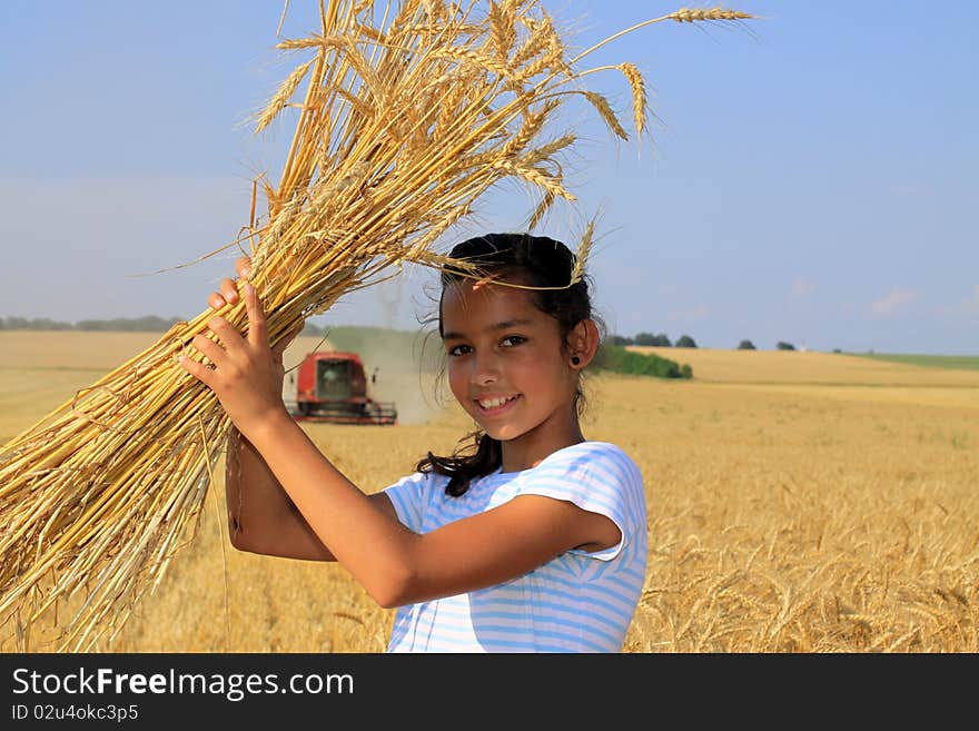 Young Gypsy girl on a grain field