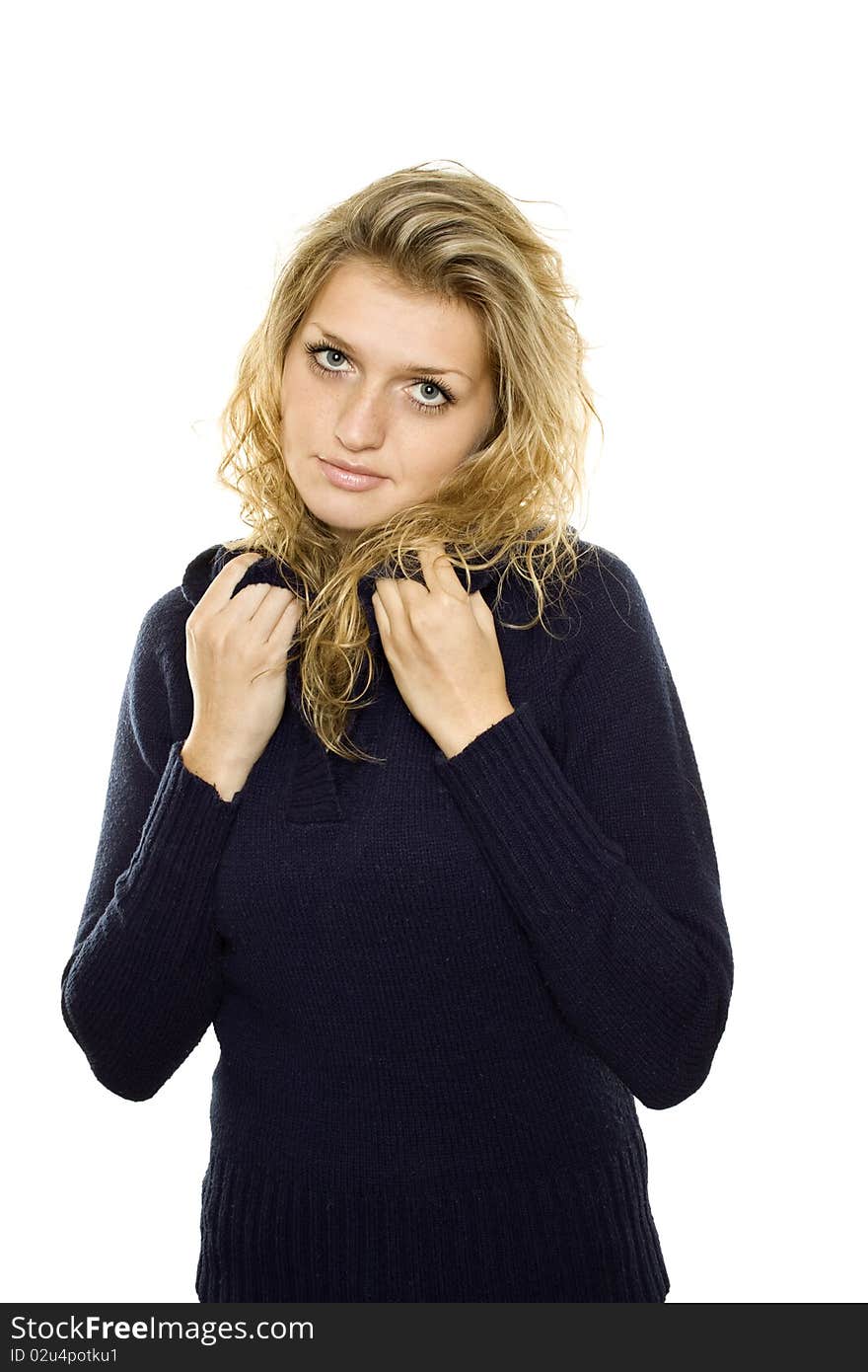 Casual young woman in a blue sweater warms. Isolated on white background