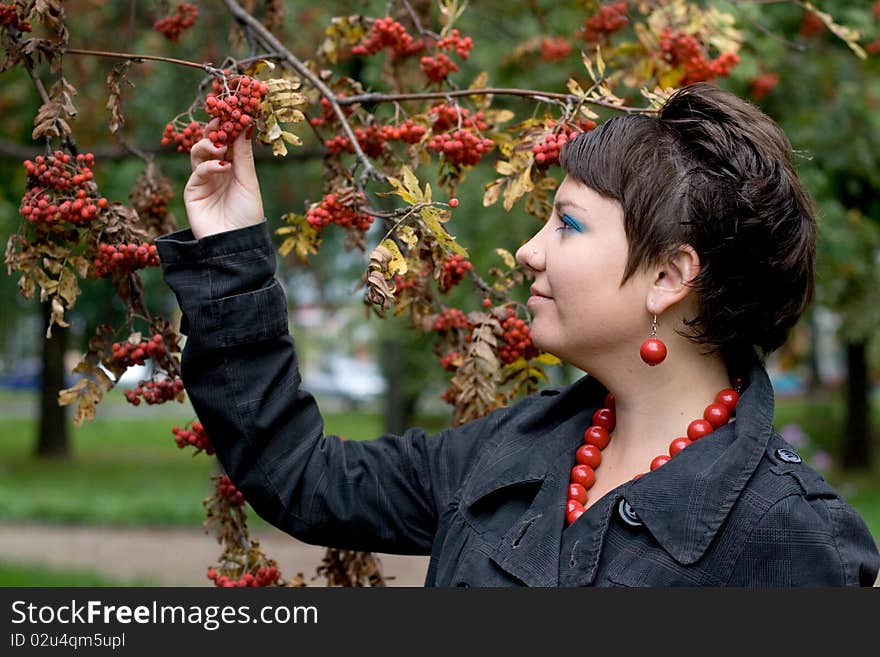 Pretty girl walking in autumn park