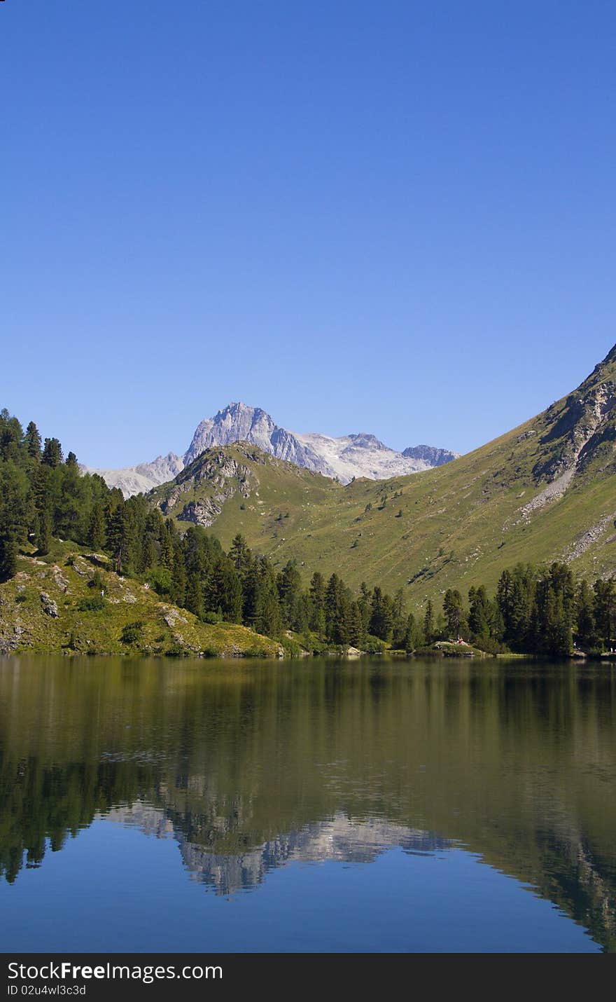 Alpine lake Cavloc Engadine in Switzerland