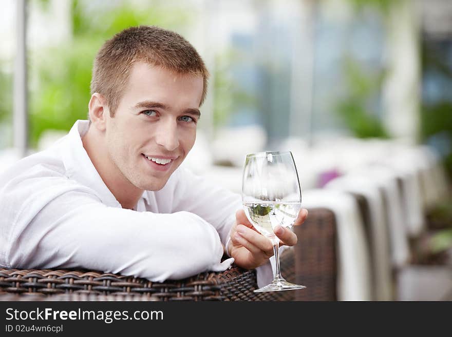 A young man in a cafe