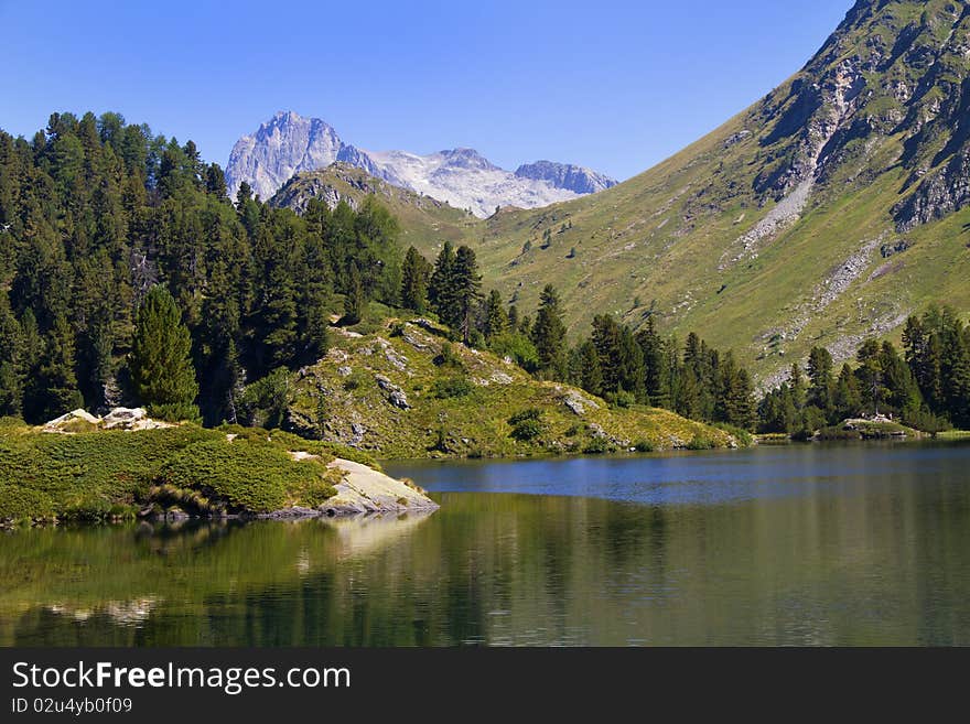 Alpine lake Cavloc Engadine in Switzerland