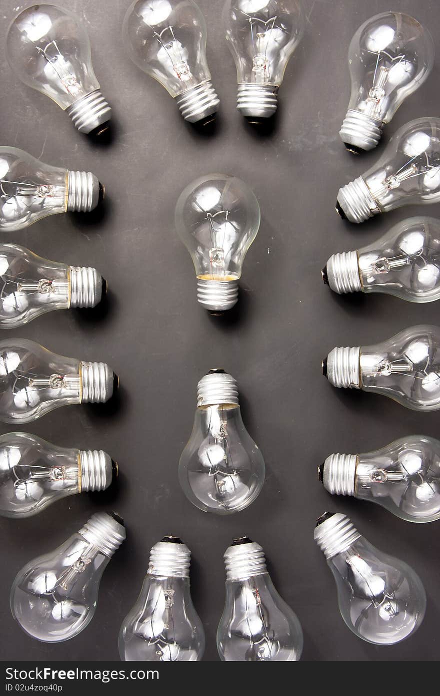 Photo of many light bulbs lying on black background. Photo of many light bulbs lying on black background