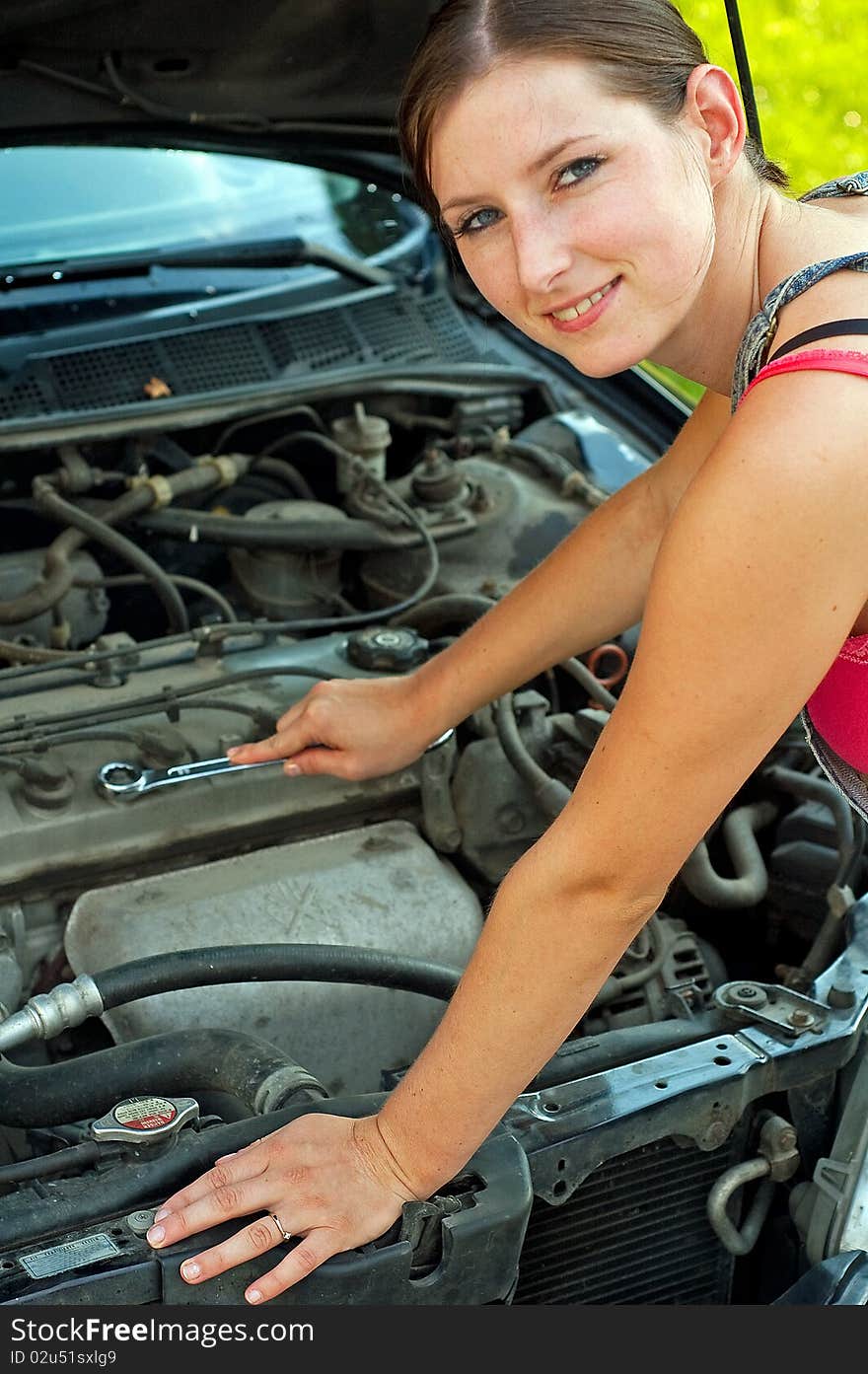 Woman with her broken down car