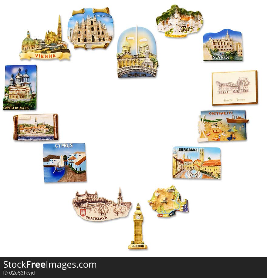 A collection of fridge magnets bought from different visited countries arranged as a heart shape frame. A collection of fridge magnets bought from different visited countries arranged as a heart shape frame