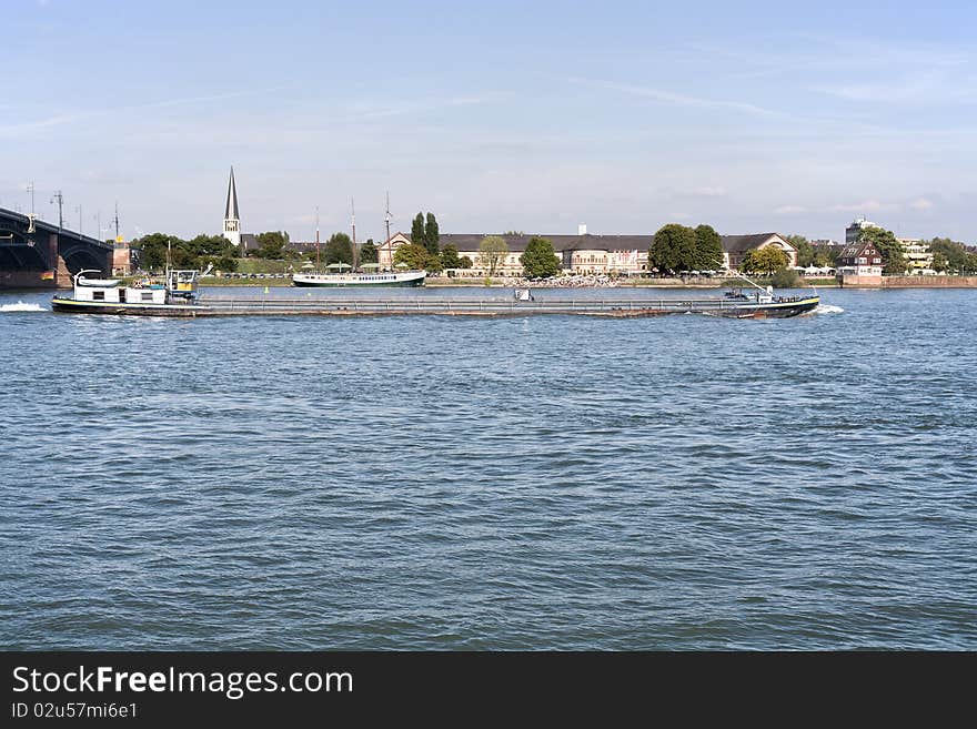 Barge at River Rhine, view over the river, clear blue sky