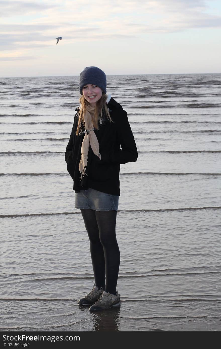 Pretty Teenage Girl on Beach in Winter