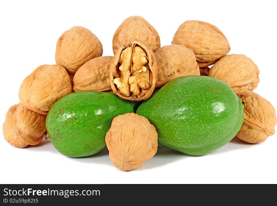 Ripe and unripe walnuts isolated on white