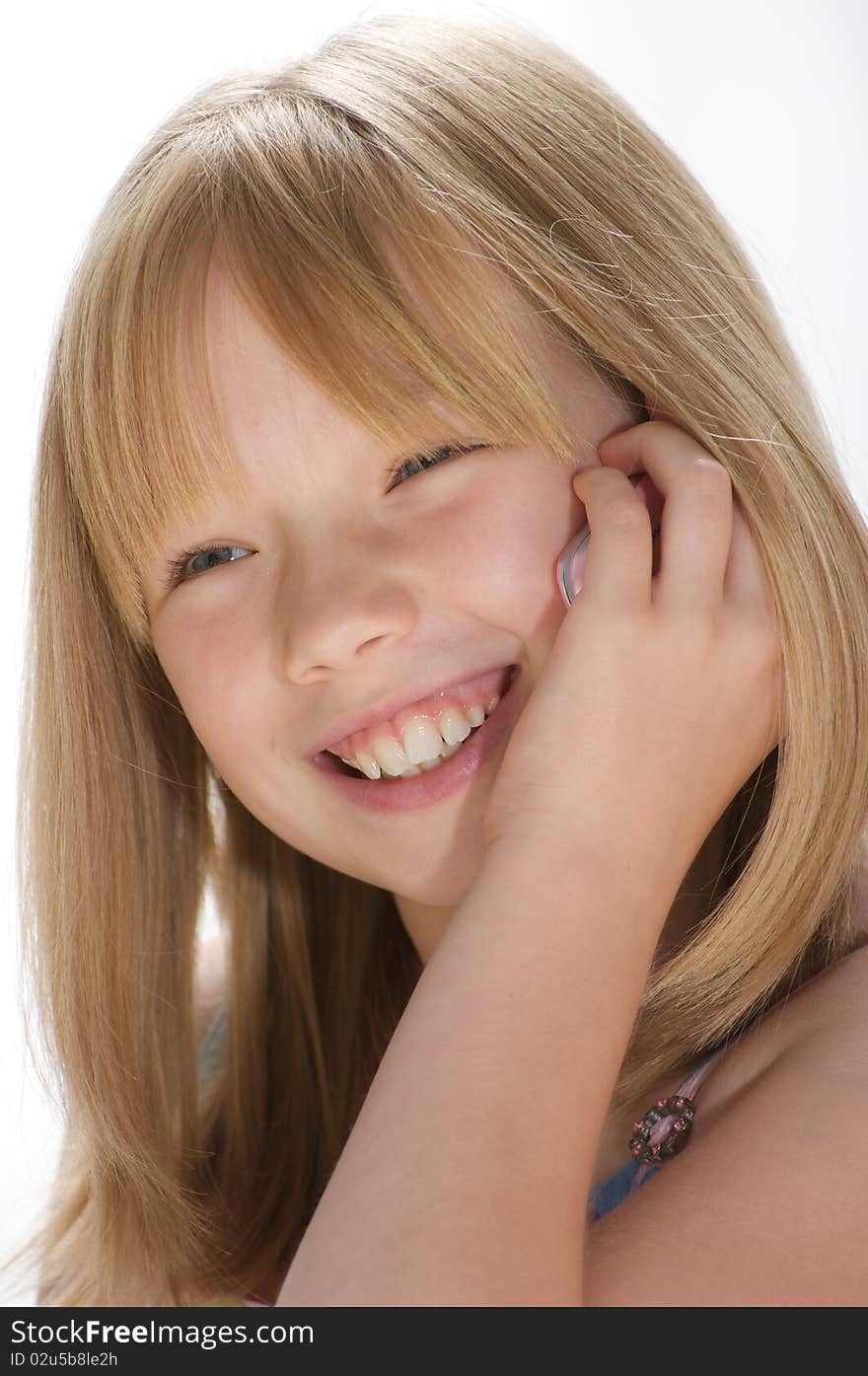 Young girl smiling on the telephone. Young girl smiling on the telephone