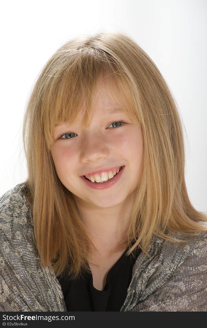 Young girl smiling and looking into the camera. Young girl smiling and looking into the camera