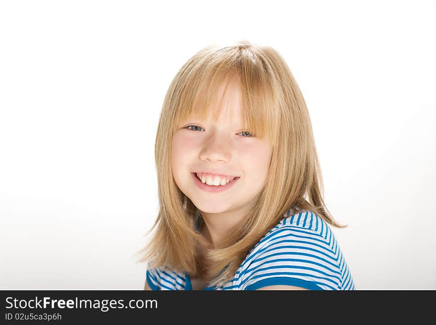 Young girl smiling and looking into the camera. Young girl smiling and looking into the camera