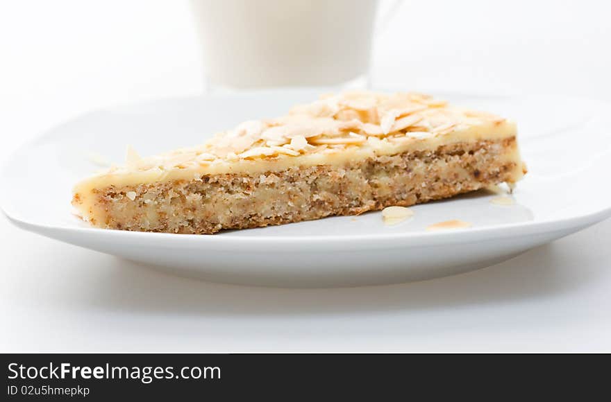 A piece of traditioanl almonf cake on a plate