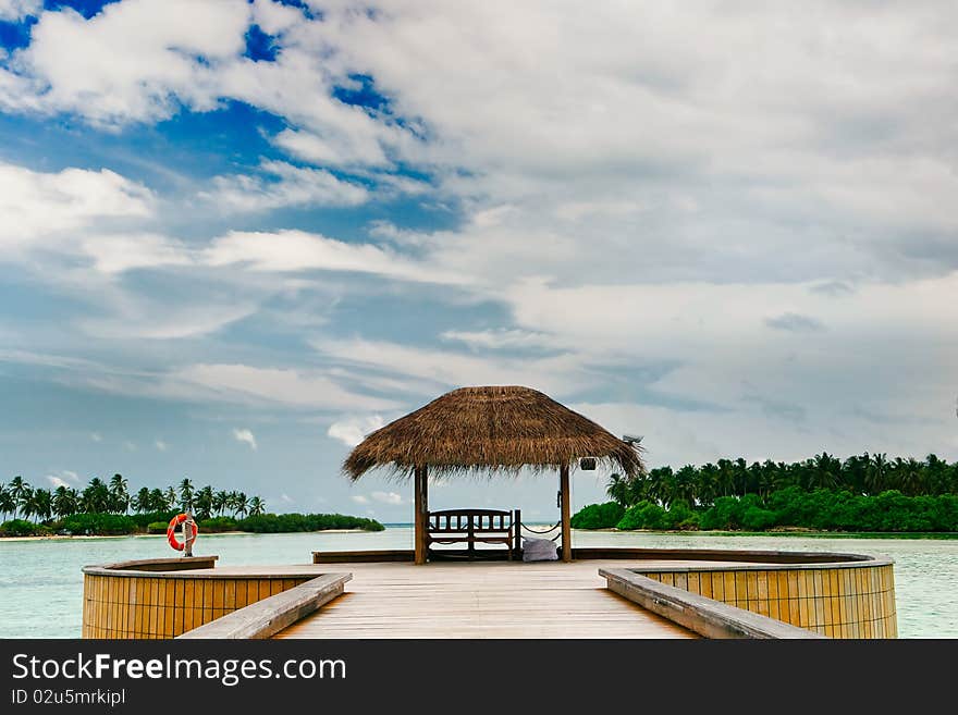 Bungalow Among Turquoise Ocean Waters