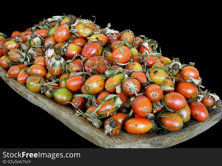 Ripe berries of dog-rose in isolated over black