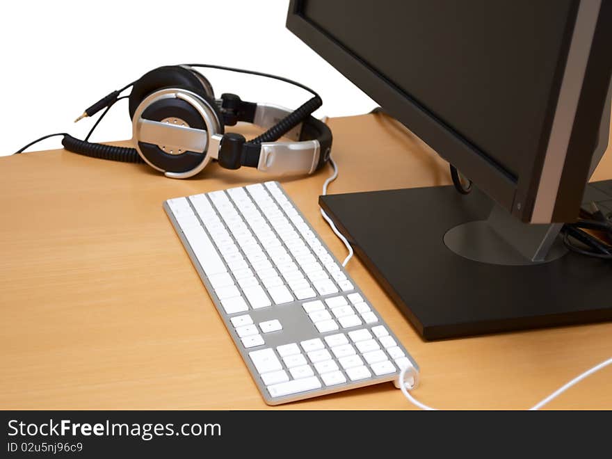 Monitor with headsets in the table, isolated on white