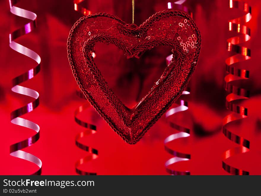 Red christmas star and ribbons on red background