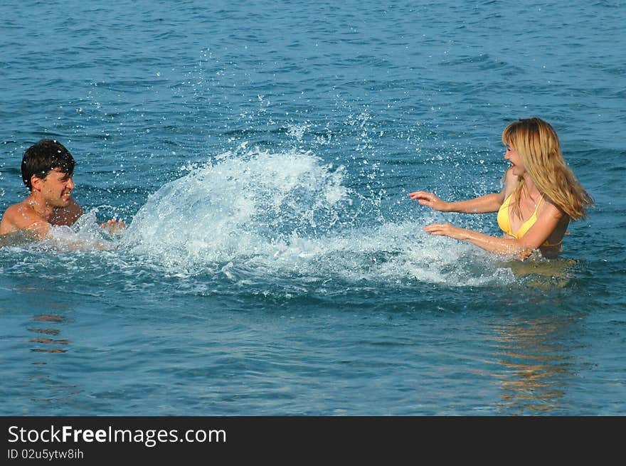 Couple have fun in the sea