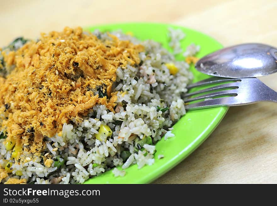 Asian vegetable olive fried rice with pork floss topping. Suitable for concepts such as diet and nutrition, healthy lifestyle, and food and beverage. Asian vegetable olive fried rice with pork floss topping. Suitable for concepts such as diet and nutrition, healthy lifestyle, and food and beverage.