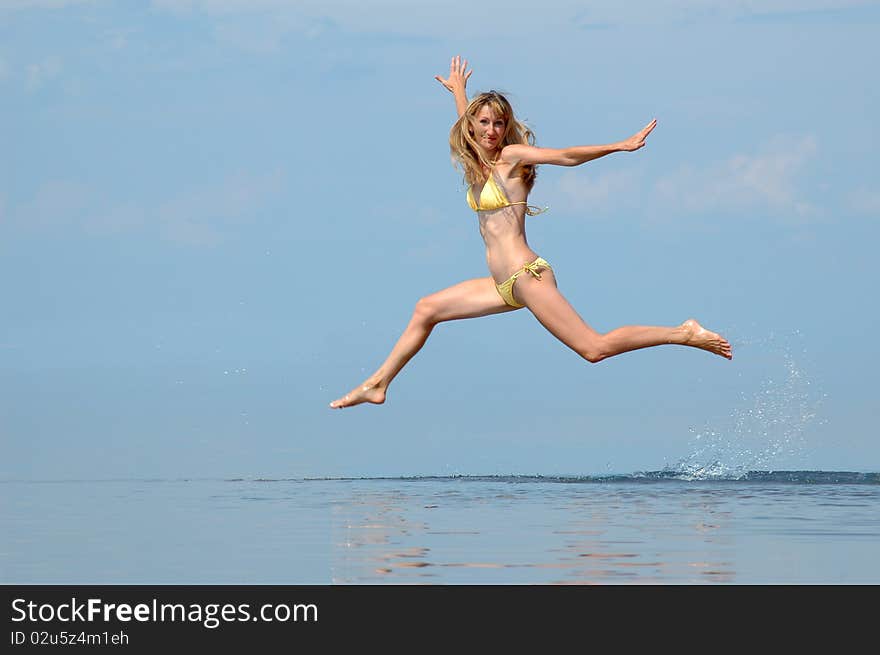 The woman jumps on water