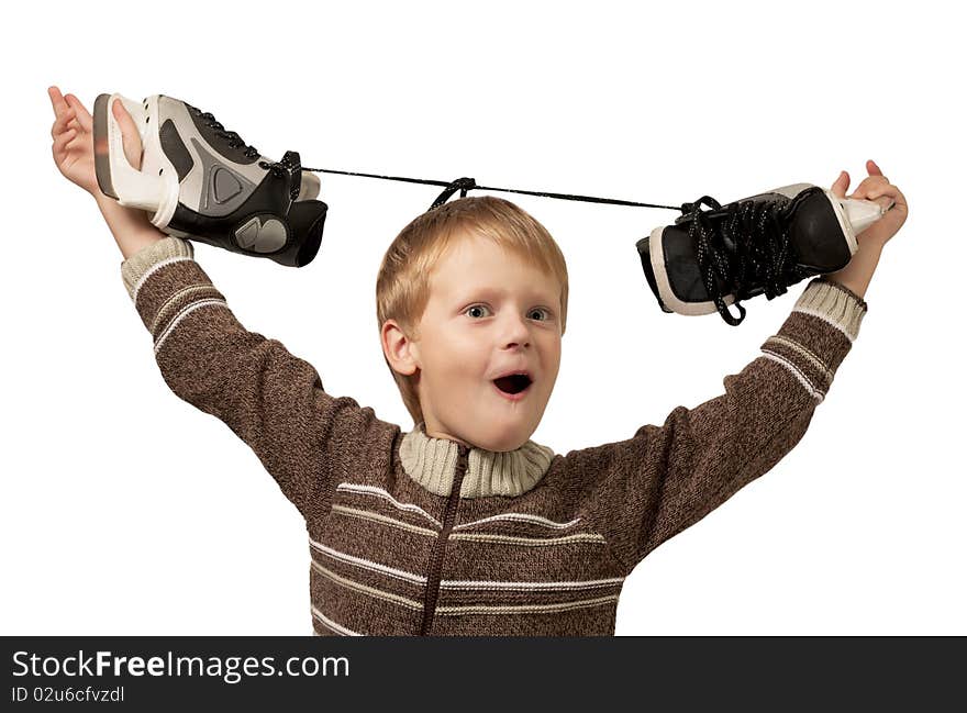 The little boy with the skates in a knitted sweater has lifted the skates over a head. Isolated on white background. The little boy with the skates in a knitted sweater has lifted the skates over a head. Isolated on white background.