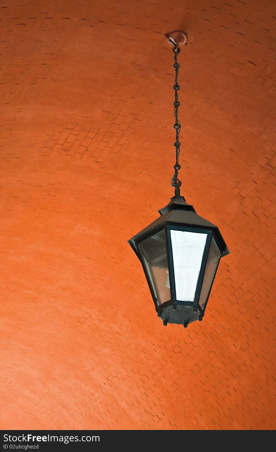 Lantern on a brick ceiling