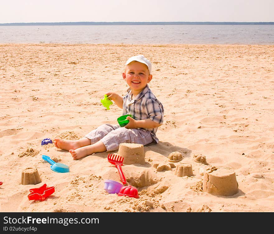 Little boy play on a beach. Little boy play on a beach