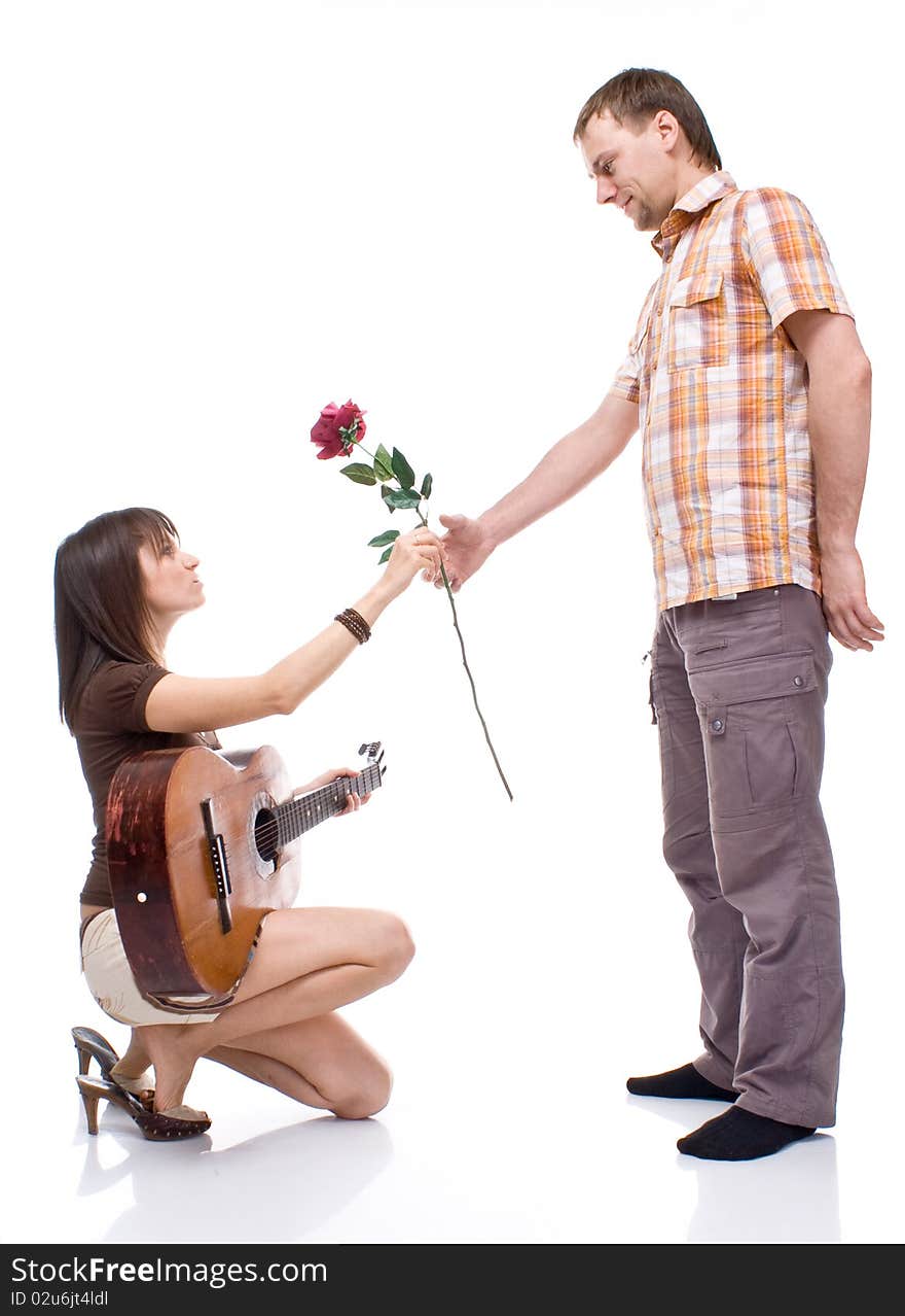 Girl gives the boy a rose on white background