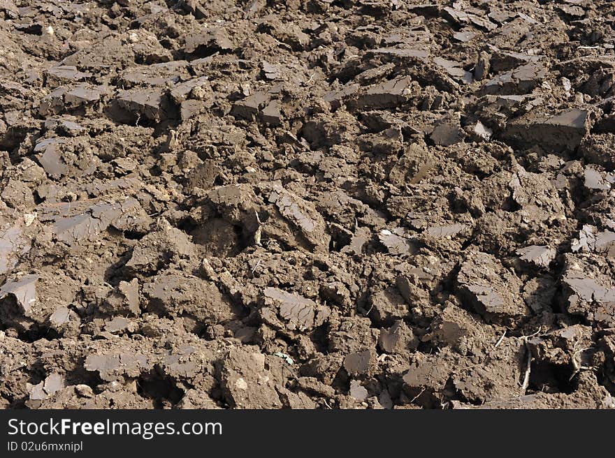 Clods of earth on a plowed field. Can be used as background.