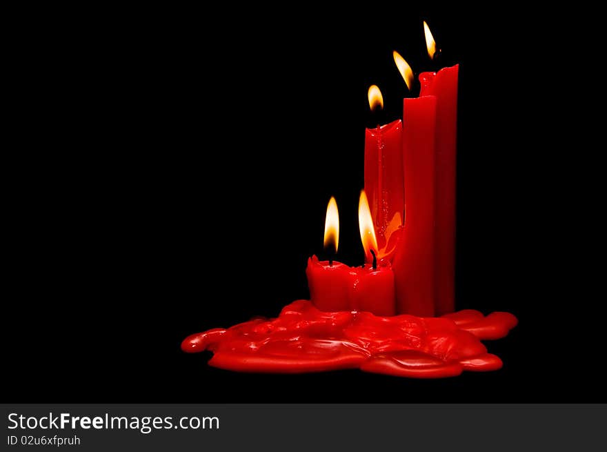 Red candles on a black background