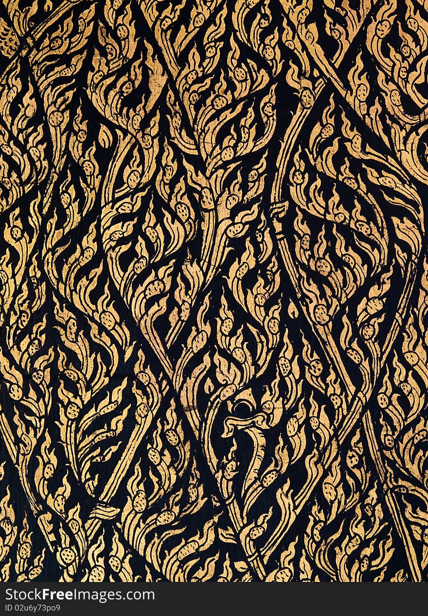 Laithai make from gold on black wall