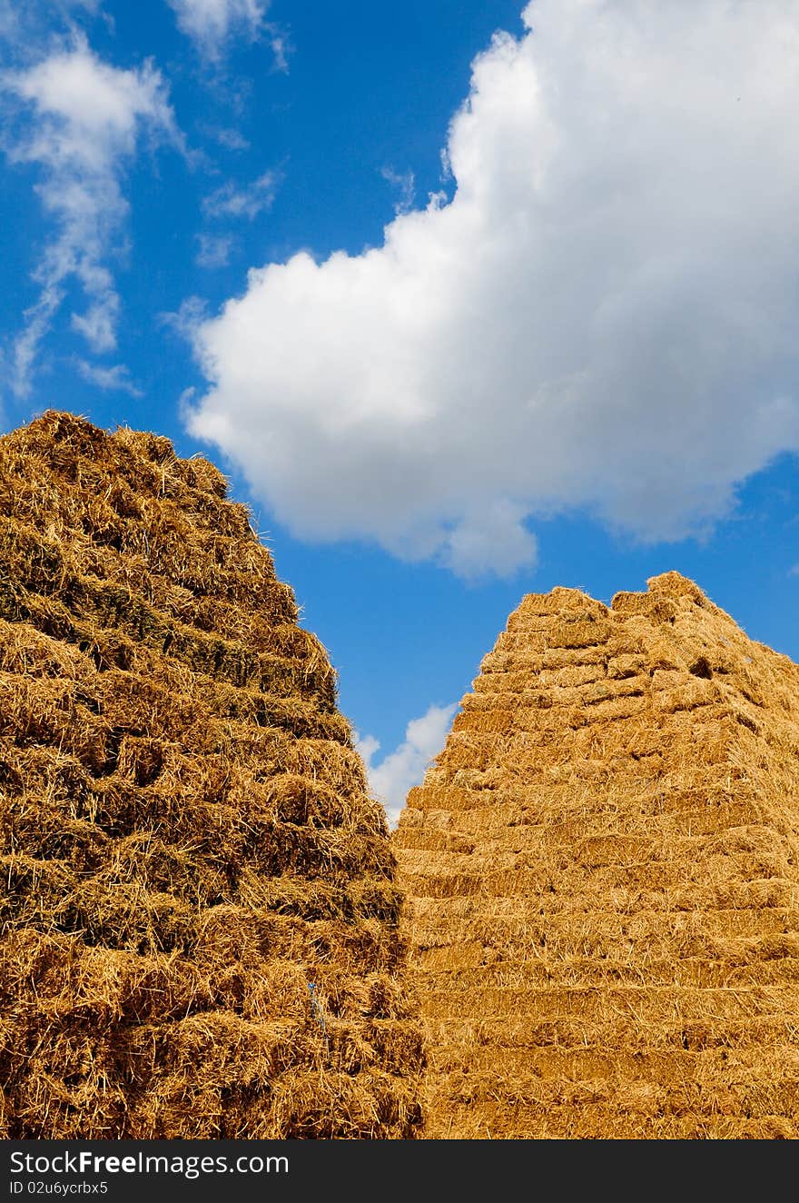 Haystack under beautiful blue sky